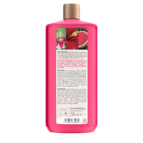 Maui Moisture styled wavy hair outdoors, shows soft defined curls and natural-looking shine