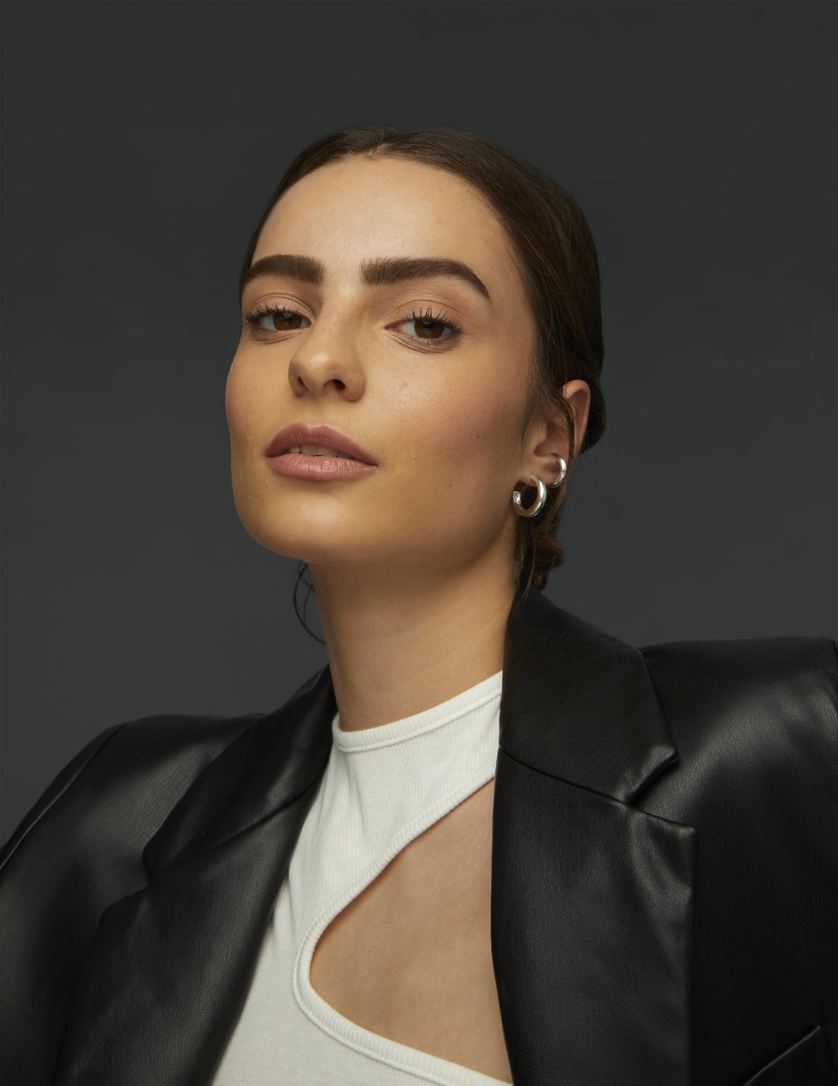 Maybelline Brow Tattoo placed on a vanity mirror in a lifestyle scene for effortless beauty routine