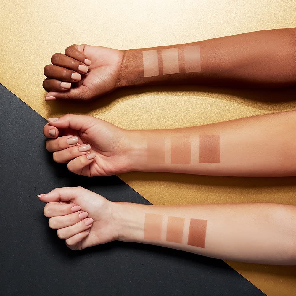 Maybelline applying bronzer to cheek showing subtle contouring benefit