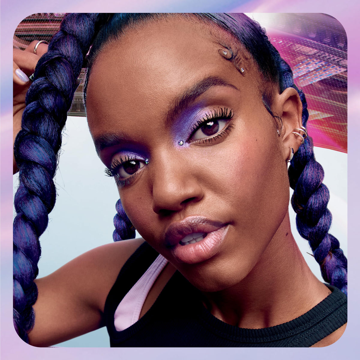 Maybelline lifestyle shot of woman wearing mascara for long-lasting dramatic lashes