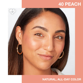 MAYBELLINE brush picking up peach blush, demonstrating easy pickup and blend