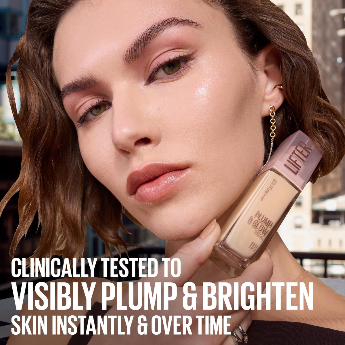 Maybelline Lifter bottle beside hand to show true size and travel-friendly benefit