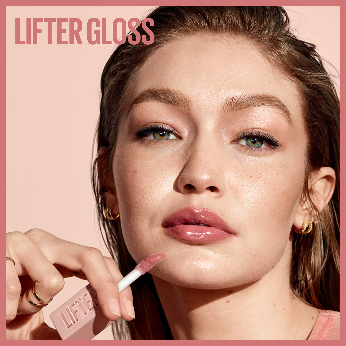Maybelline removing gloss with micellar water to show gentle makeup removal