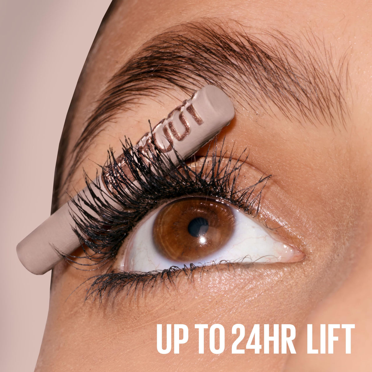 Maybelline mascara next to ruler showing compact size for travel