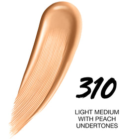 Maybelline close-up swatch on arm demonstrating shade 310 and natural coverage result
