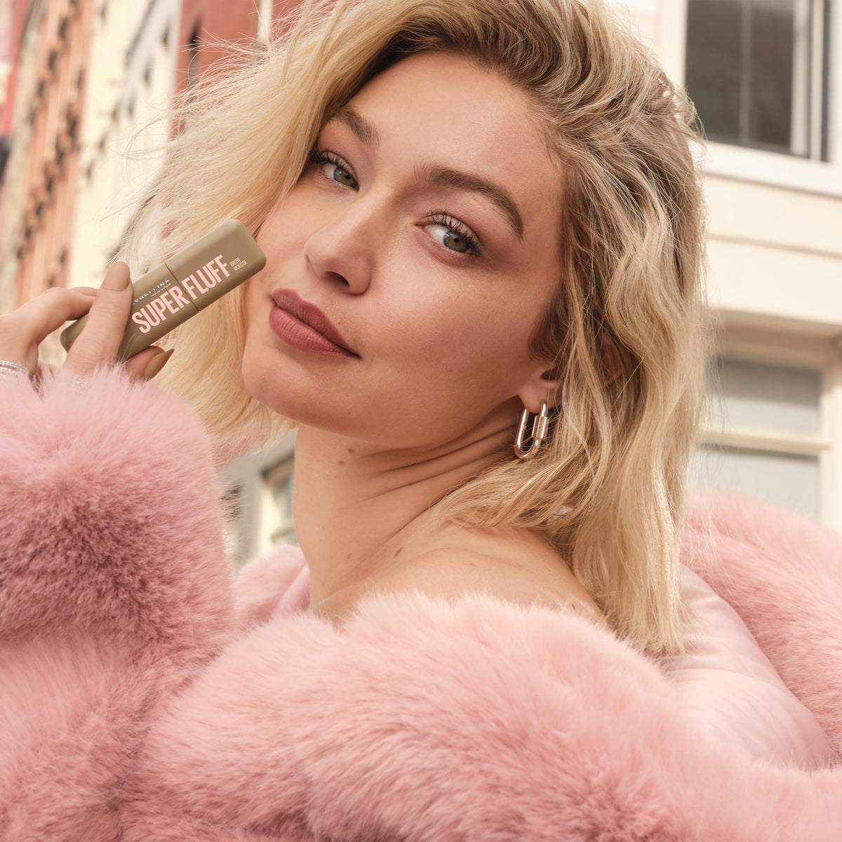Maybelline Superfluff on bathroom vanity in lifestyle scene suggesting everyday routine use