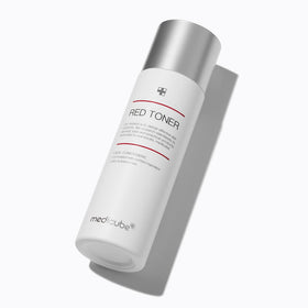 medicube red toner in hand to show size and travel-friendly 3.38 fl oz convenience