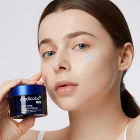 Medicube jar opened showing product inside for visible smooth cream