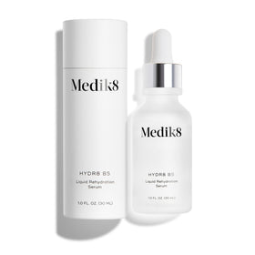 Medik8 serum next to towel in bathroom conveying easy daily routine benefit