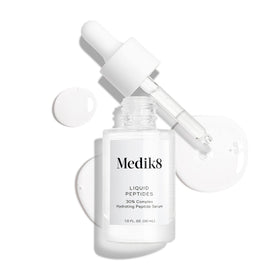 Medik8 bottle staged on bathroom shelf showing everyday routine compatibility benefit