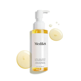 Medik8 4.7 oz bottle next to common objects to show travel-friendly size