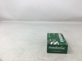 Medimix single bar close-up showing handmade texture and visible botanical flecks for natural appeal