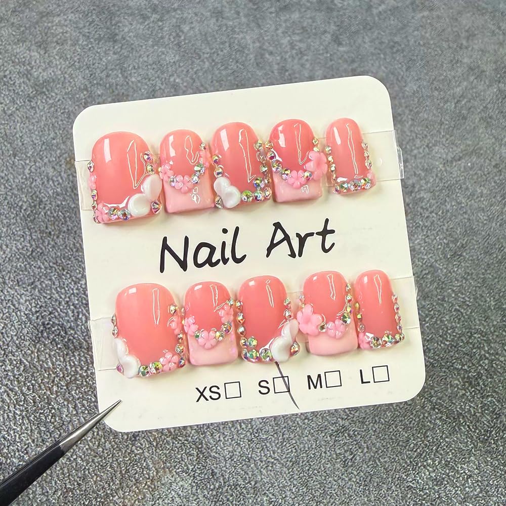 meemooron rhinestones on pink French tips highlighting sparkle and salon-style finish