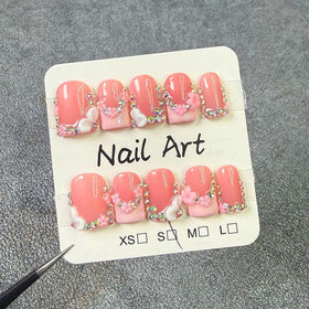 meemooron rhinestones on pink French tips highlighting sparkle and salon-style finish