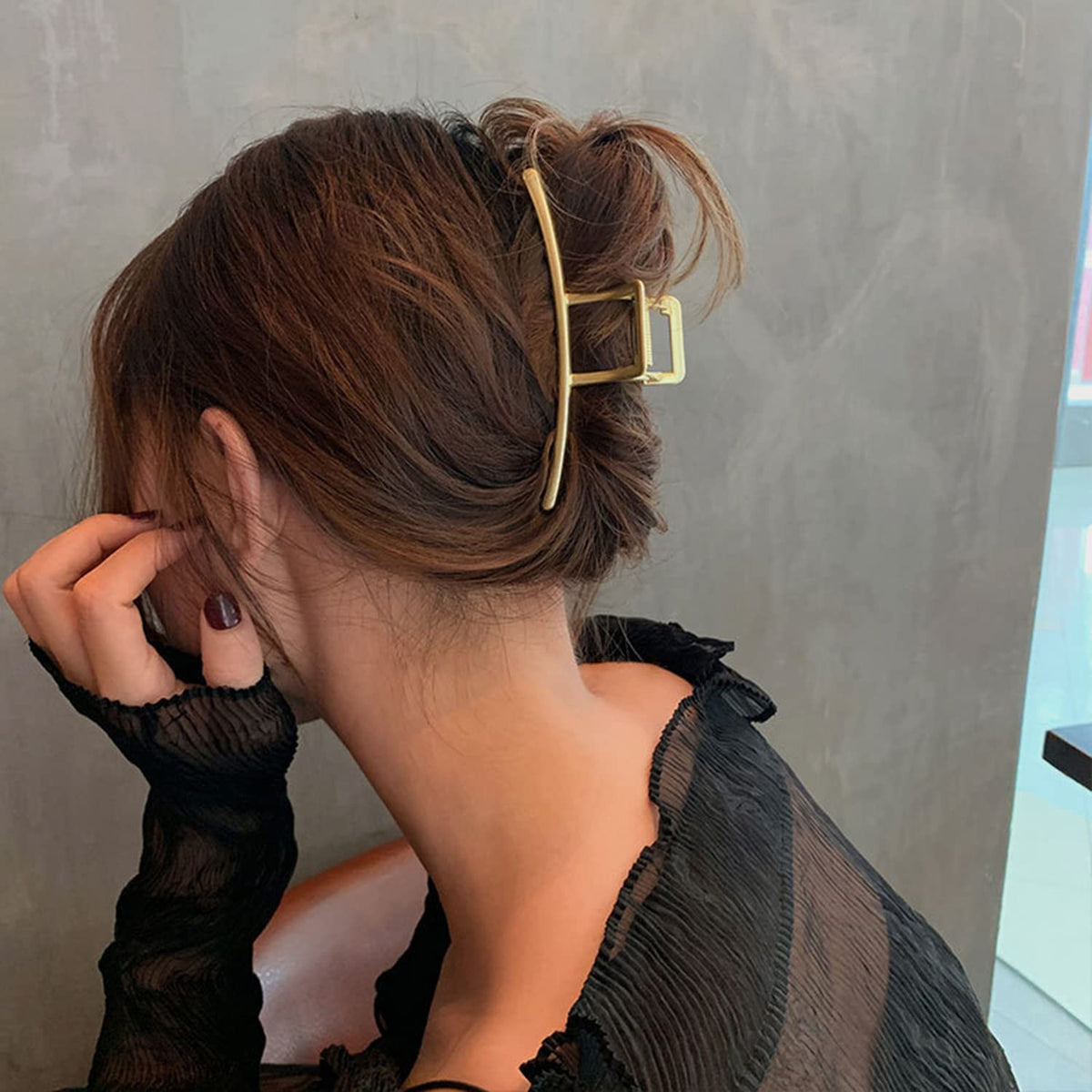 Mehayi half-up hairstyle using the clip to add volume and polished look