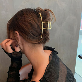 Mehayi half-up hairstyle using the clip to add volume and polished look