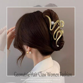Mehayi clip in hand for scale, illustrating size for long thick hair
