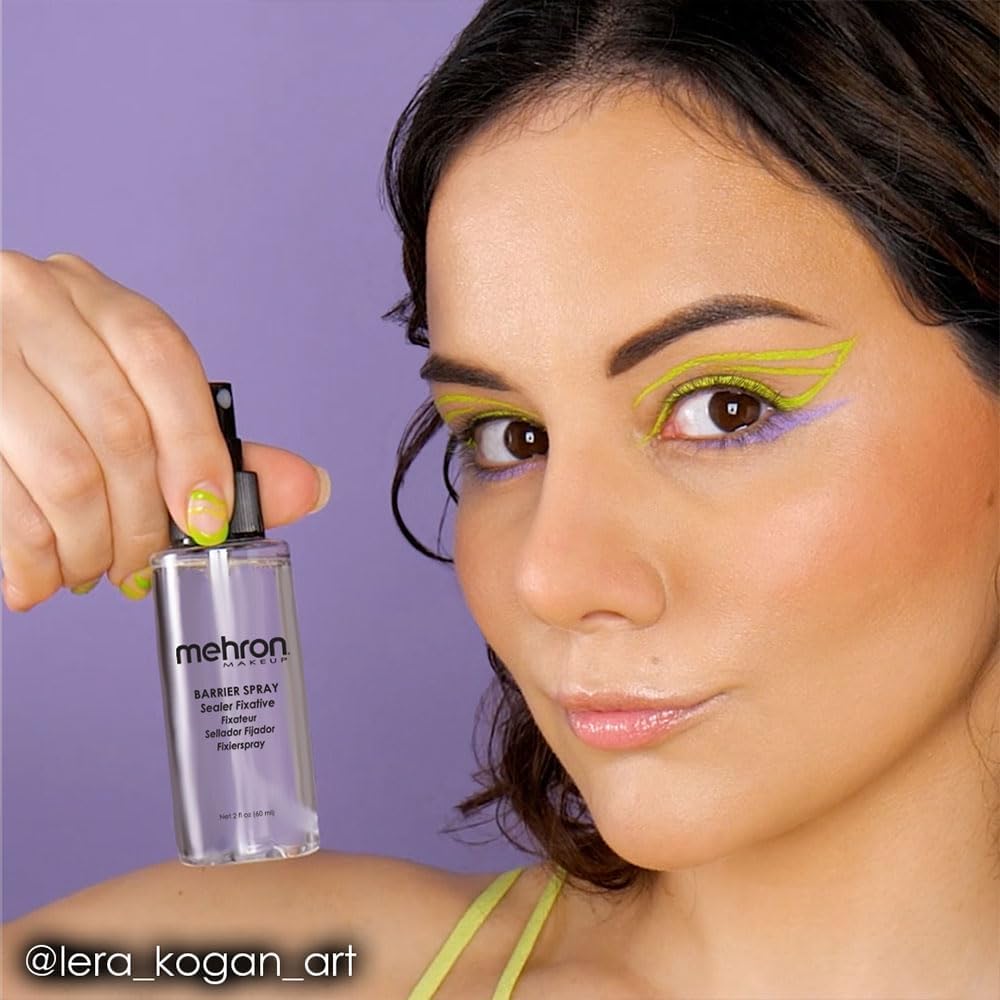 Mehron bottle in hand indicating 9 fl oz size and kit-ready benefit