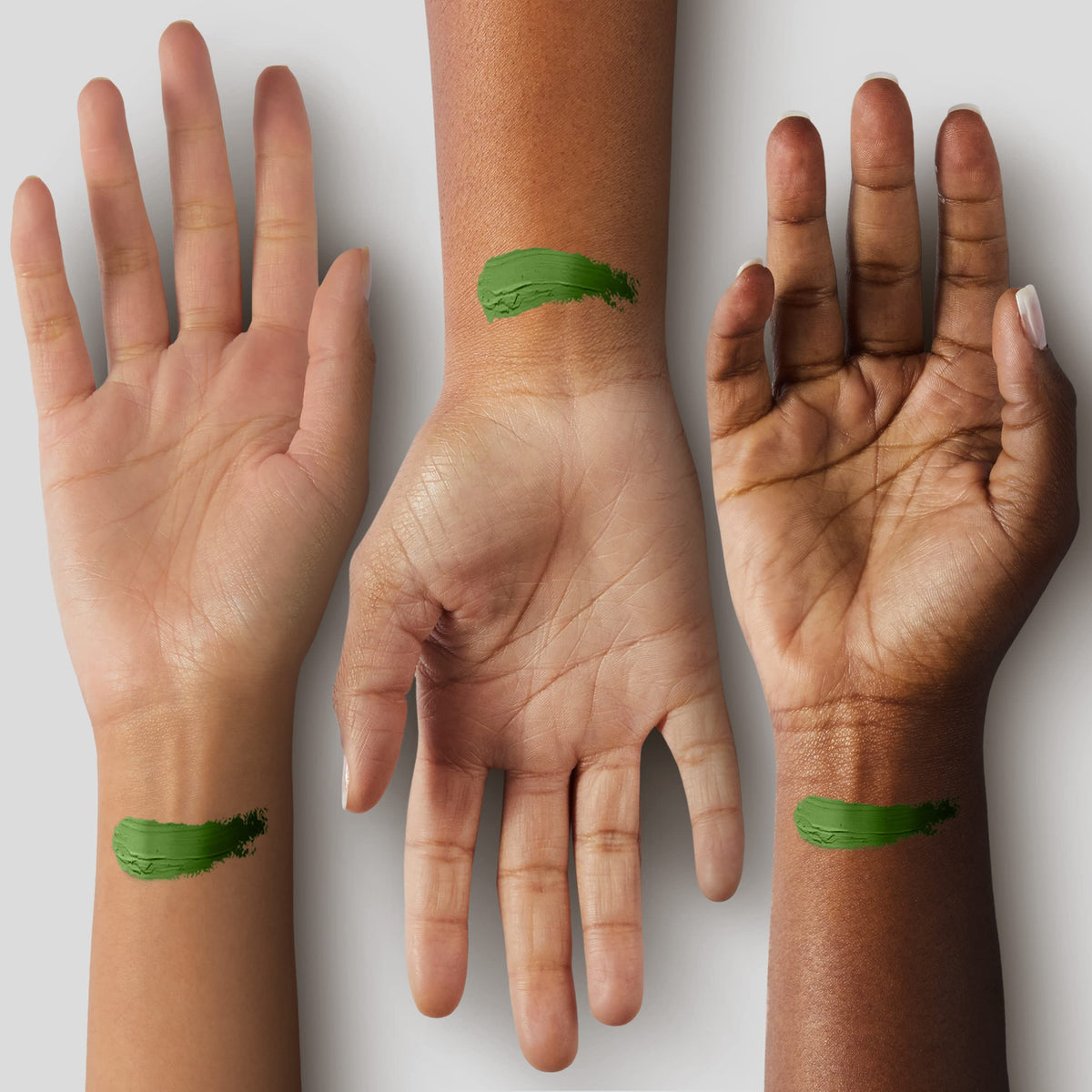 Mehron green swatch on forearm demonstrating bold pigment payoff and buildability