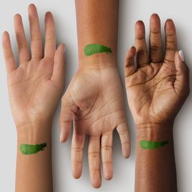 Mehron green swatch on forearm demonstrating bold pigment payoff and buildability