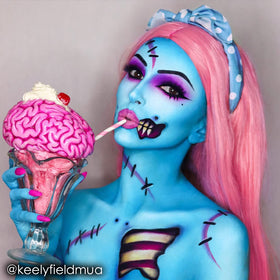 Mehron Paradise AQ light blue painted on model face for stage-ready vibrant color