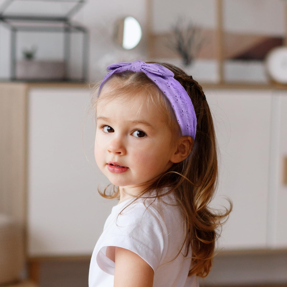 Melbelia side profile on model wearing headband showing secure fit and comfortable non-slip benefit