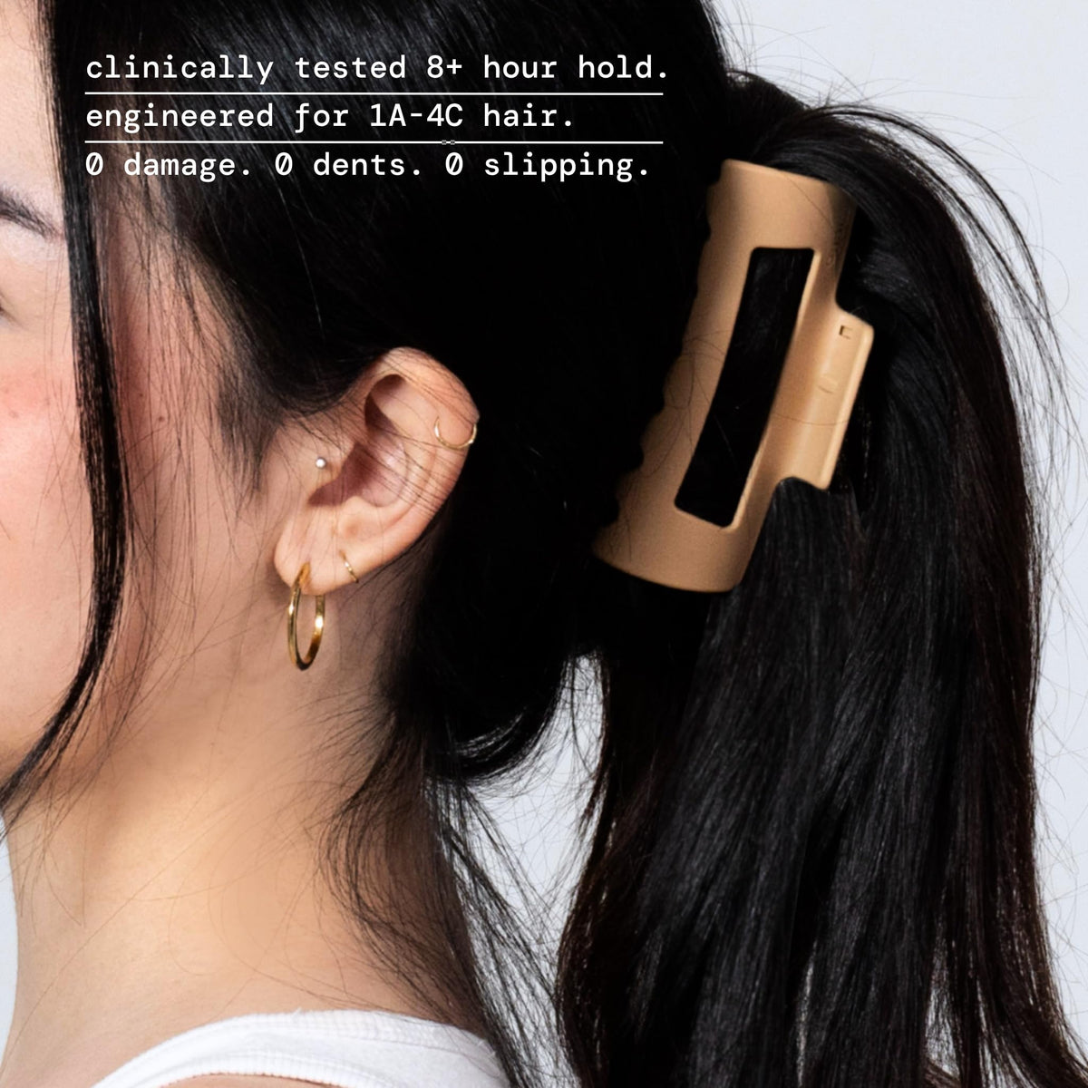 MELLO hand holding clip to show medium size and travel-friendly convenience