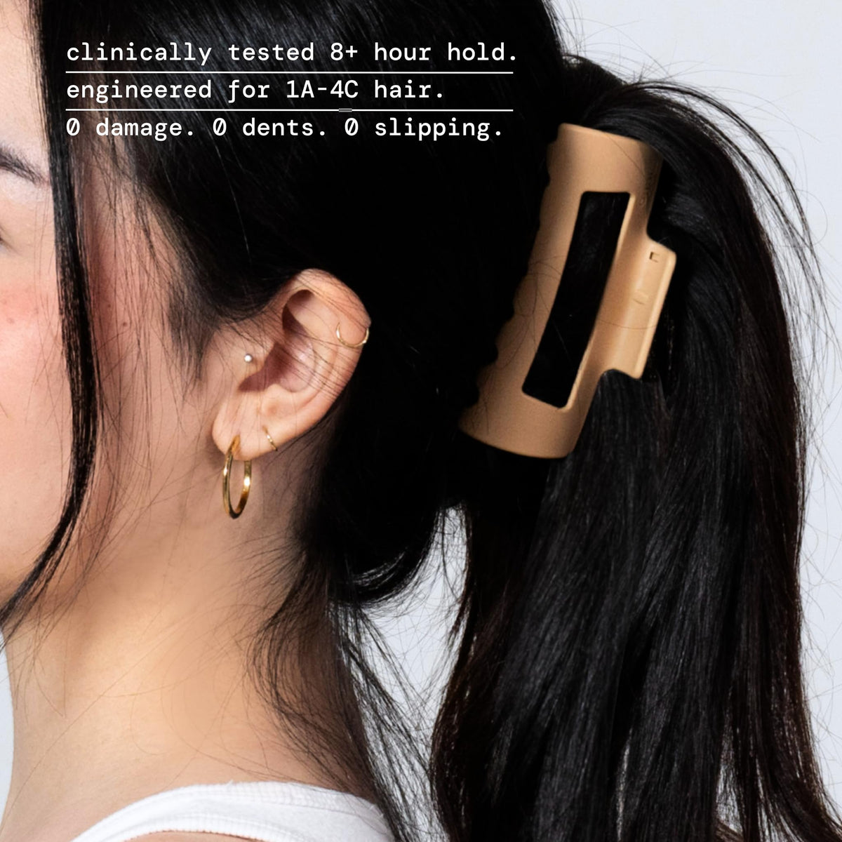 MELLO clip flexed flat against a pillow demonstrating durable unsnappable material