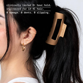 MELLO clip flexed flat against a pillow demonstrating durable unsnappable material
