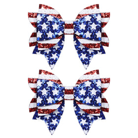 melyde front view of red and blue glitter bow clips showing festive look