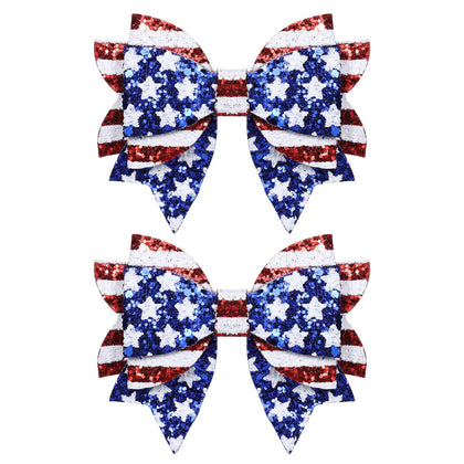 melyde front view of red and blue glitter bow clips showing festive look