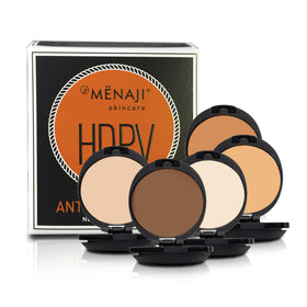Male applying Menaji powder in mirror demonstrating quick shine control during morning routine