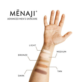 Menaji compact held in hand showing size and portability for on-the-go matte touch-ups