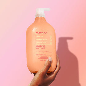 Method bottle staged in bathroom scene conveying eco friendly and spa like experience