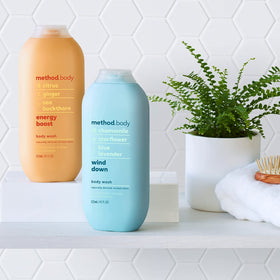 Method bottle in shower hand demonstrating easy dispensing and energizing scent