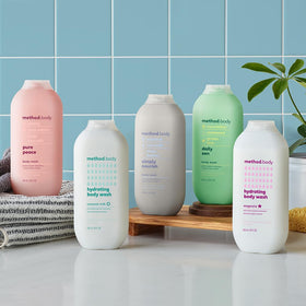 Method lifestyle shower scene with bottle on shelf conveying refreshing routine