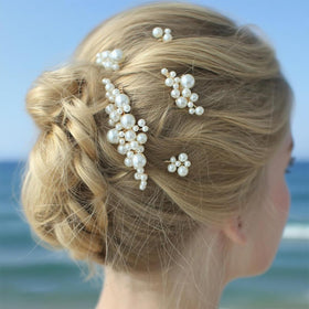 MHKLCD pins styled in a wedding scene adding classic pearl accents
