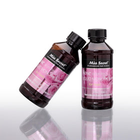 Mia Secret bottle on salon station with brush and powder showing client-friendly atmosphere