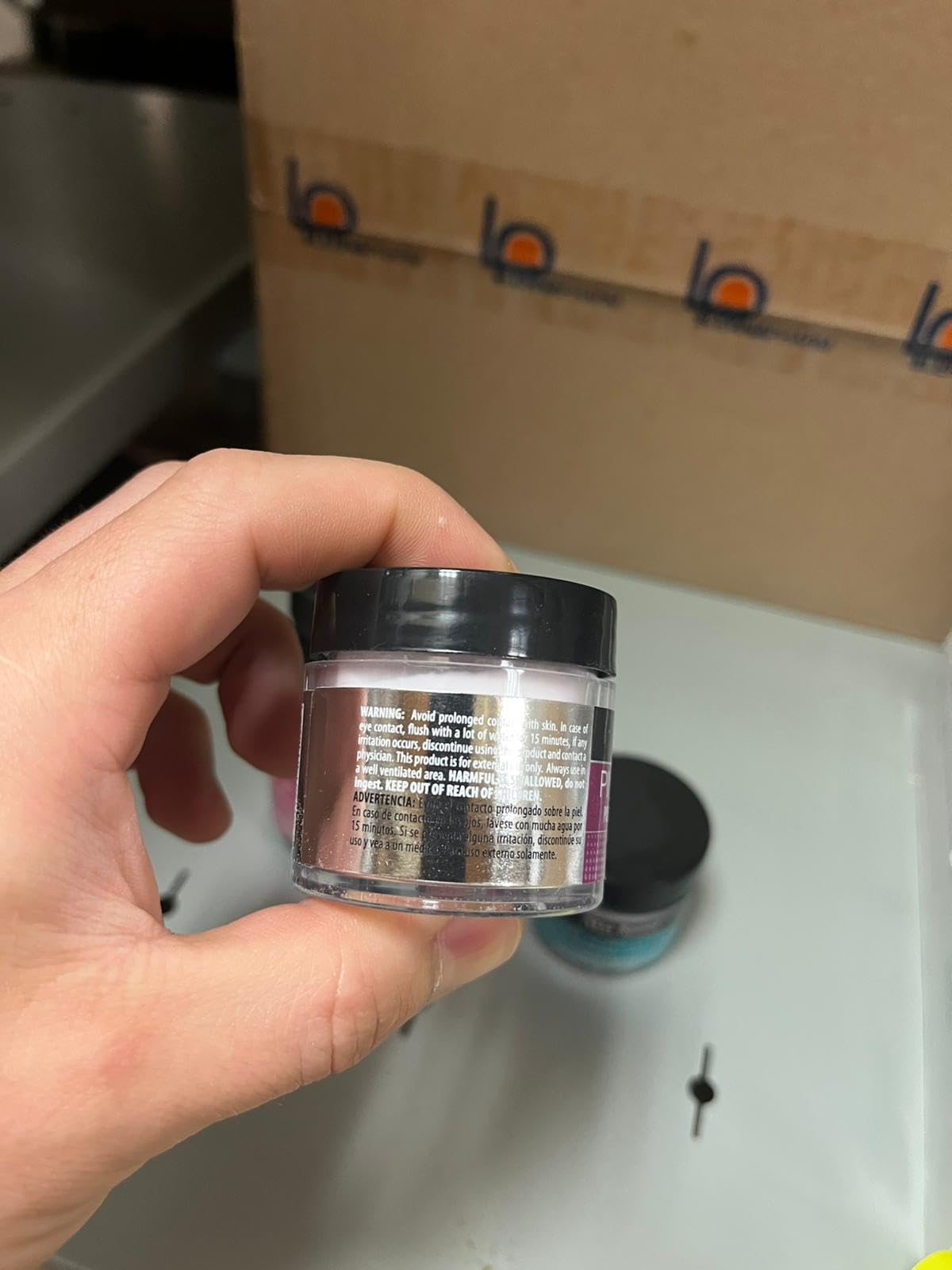 Mia Secret kit beside a hand for scale, showing compact kit advantage for travel