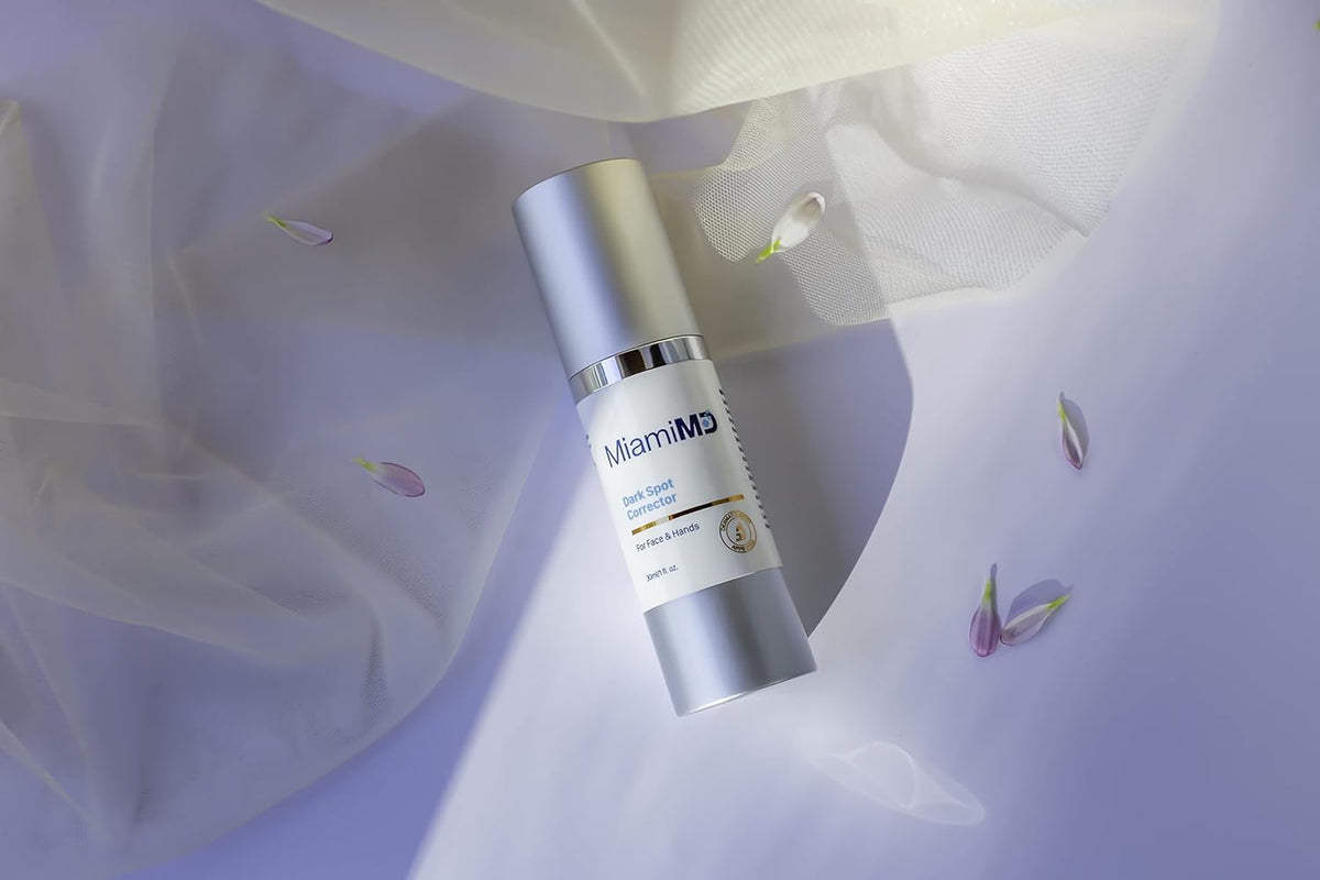 MiamiMD dabbing serum on cheek illustrating gentle use and even tone benefit
