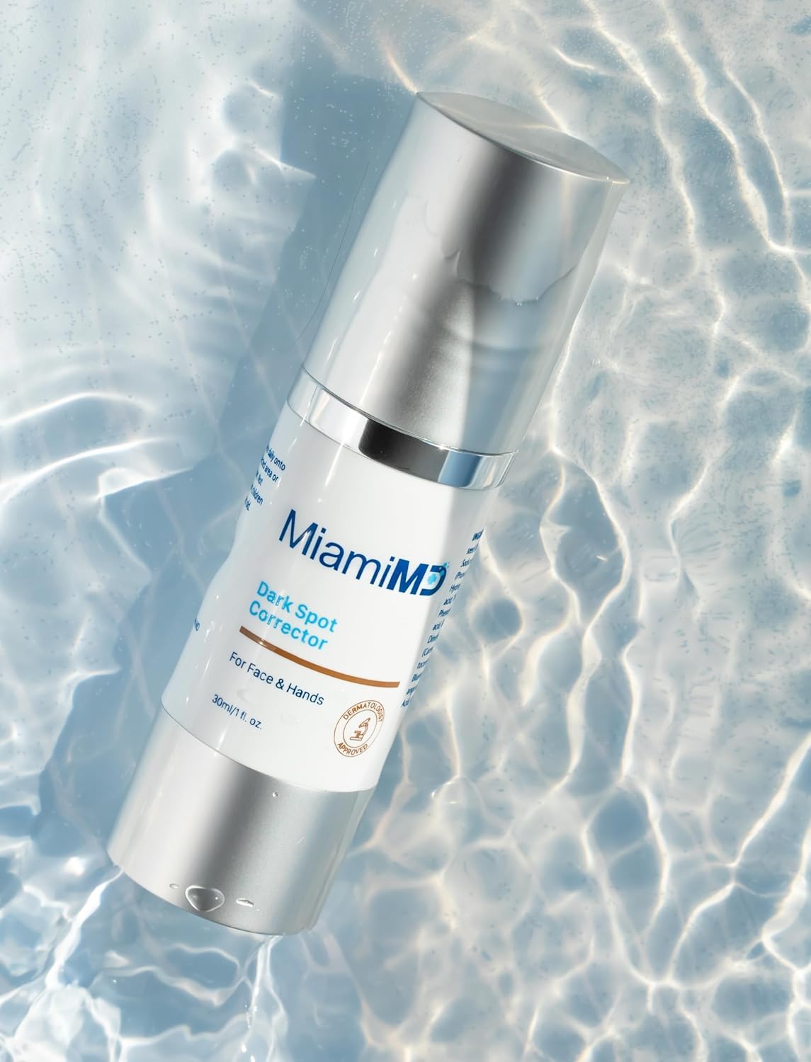 MiamiMD applying serum to hands showing targeted spot treatment benefit