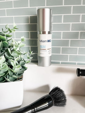 MiamiMD serum on bathroom vanity suggesting daily routine and radiant skin benefit