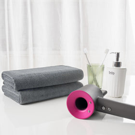 MICROFI towel beside ruler showing generous size for all hair lengths
