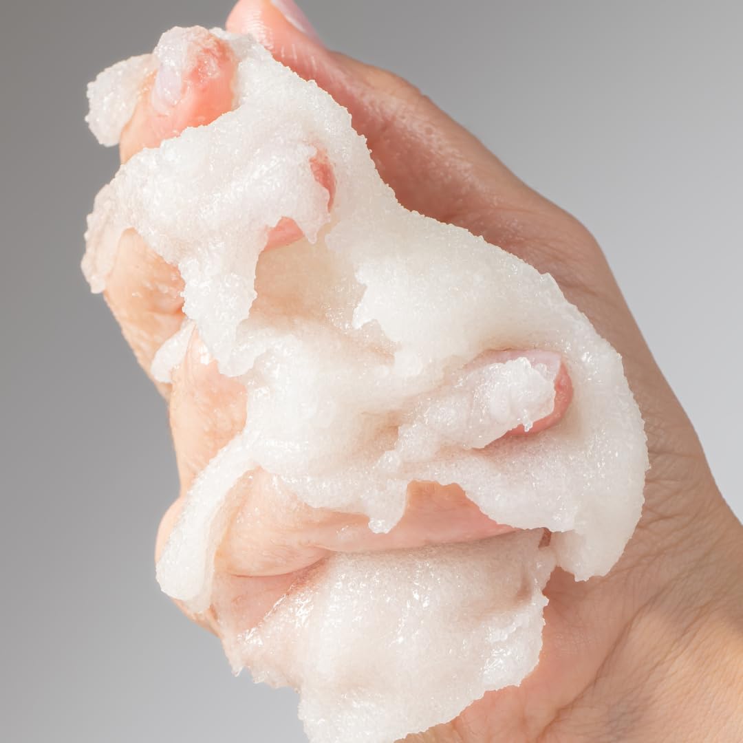 Miel scrub on hand demonstrating application and easy spreadability