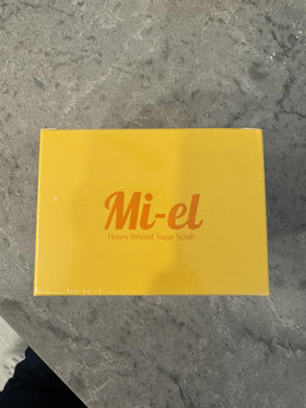 Miel jar beside a hand to show size and travel-friendly 8.5 oz volume