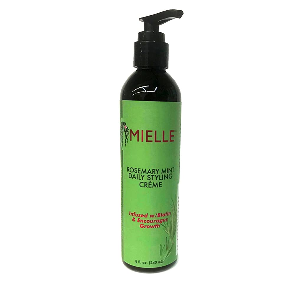 Mielle Organics styling crème smoothed onto damp hair to tame frizz and add manageability
