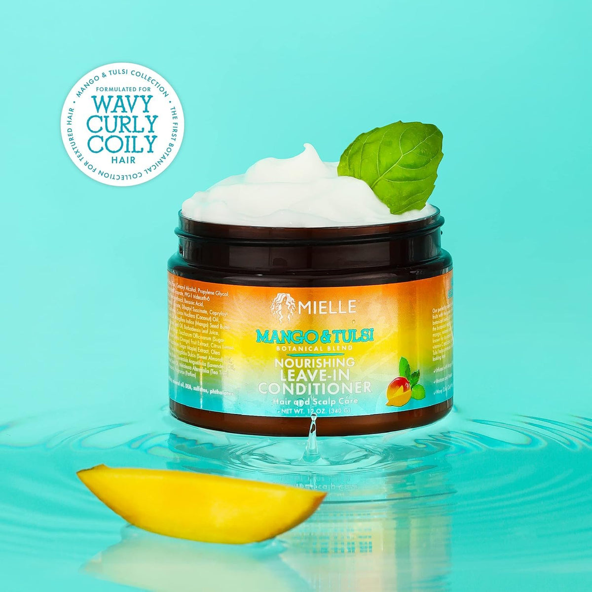 Mielle Organics 12 oz bottle held to show size and portability