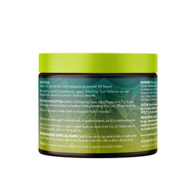 Mielle Organics used by person outdoors showing defined curls and shine