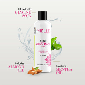 Applying Mielle Organics oil to scalp to soothe and lock in moisture