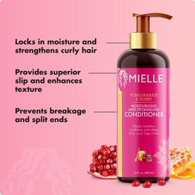 Mielle Organics 12 oz bottle held to show size and easy dispensing